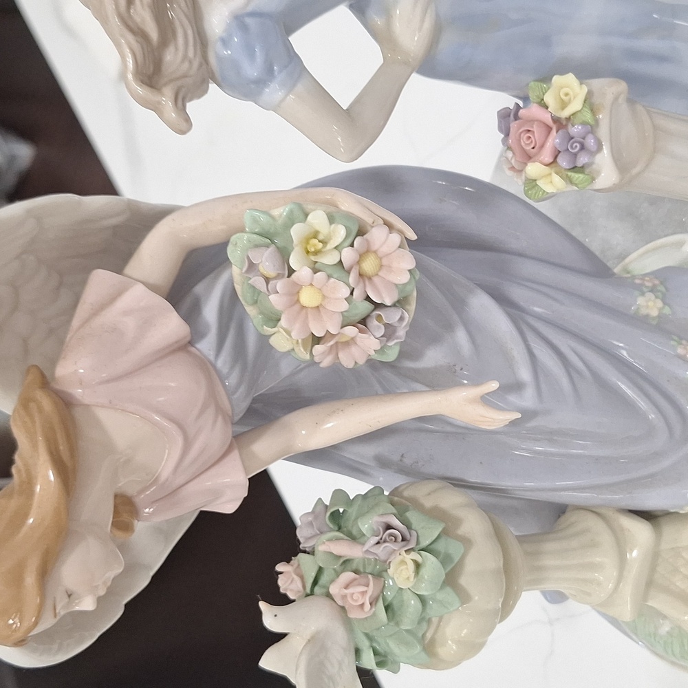 Elegant Angel Figurine with Floral Bouquet